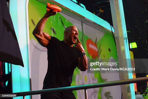 Actor Dwayne Johnson accepts the Kids' Choice Award for Favorite Male Buttkicker onstage during Nickelodeon's 26th Annual Kids' Choice Awards at USC...