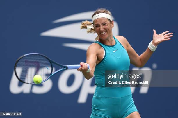 Victoria Azarenka returns a shot against Fiona Ferro of France during their Women's Singles First Round match on Day One of the 2023 US Open at the...