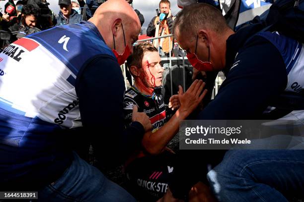 Remco Evenepoel of Belgium and Team Soudal - Quick Step injured after winning the stage and colliding with medic Raquel Ortolano of Spain's Team...