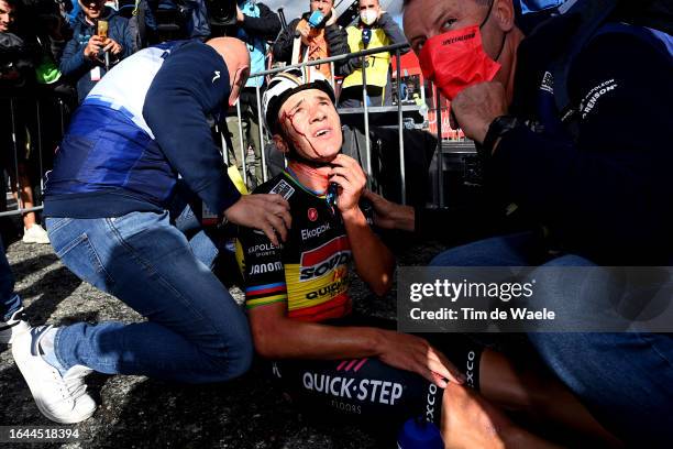 Remco Evenepoel of Belgium and Team Soudal - Quick Step injured after winning the stage and colliding with medic Raquel Ortolano of Spain's Team...