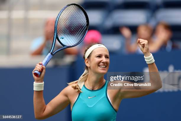Victoria Azarenka celebrates match point against Fiona Ferro of France during their Women's Singles First Round match on Day One of the 2023 US Open...