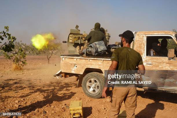 Syrian Arab fighters are positioned on the Mahsali and Arab Hasan frontline, on the Turkish-held outskirts of Manbij in northeastern Syria, as they...