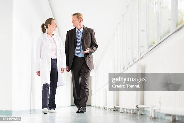 doctor and businessman - hhp5 stock pictures, royalty-free photos & images