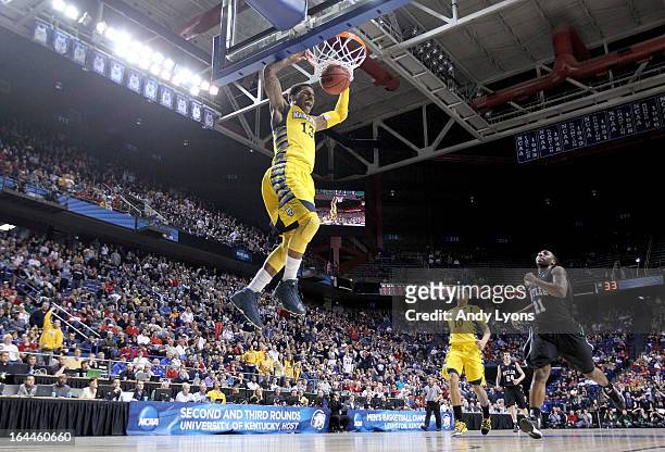 Vander Blue of the Marquette Golden Eagles dunks the ball during the third round game against the Butler Bulldogs in the 2013 NCAA Men's Basketball...