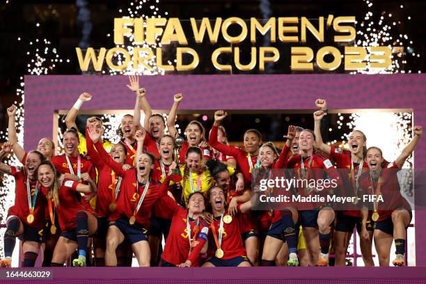 Ivana Andres of Spain and teammates celebrate with the FIFA Women's World Cup Trophy following victory in the FIFA Women's World Cup Australia & New...