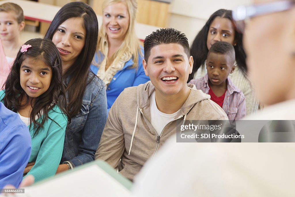 Parents and students attending school assembly or orientation