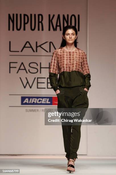 Model showcases designs by Nupur Kanoi on the runway during day two of the Lakme Fashion Week Summer/Resort 2013 on March 23, 2013 at Grand Hyatt in...