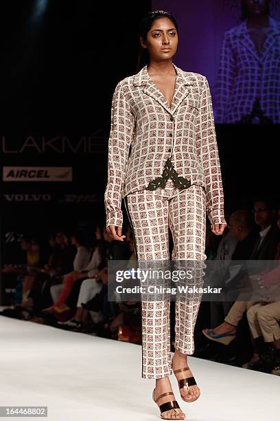 Model showcases designs by Nupur Kanoi on the runway during day two of the Lakme Fashion Week Summer/Resort 2013 on March 23, 2013 at Grand Hyatt in...