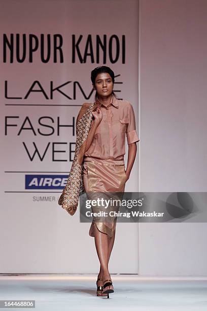 Model showcases designs by Nupur Kanoi on the runway during day two of the Lakme Fashion Week Summer/Resort 2013 on March 23, 2013 at Grand Hyatt in...