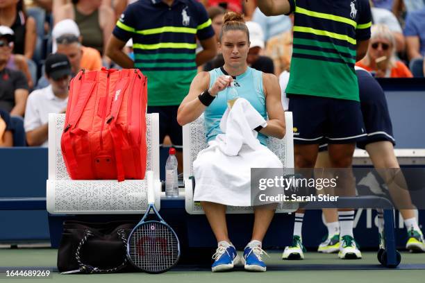 Maria Sakkari of Greece cools off between sets against Rebeka Masarova of Spain during their Women's Singles First Round match on Day One of the 2023...