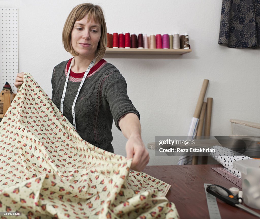 Designer spreads fabric