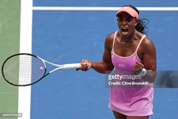 Sloane Stephens of the United States celebrates a point against Beatriz Haddad Maia of Brazil during their Women's Singles First Round match on Day...