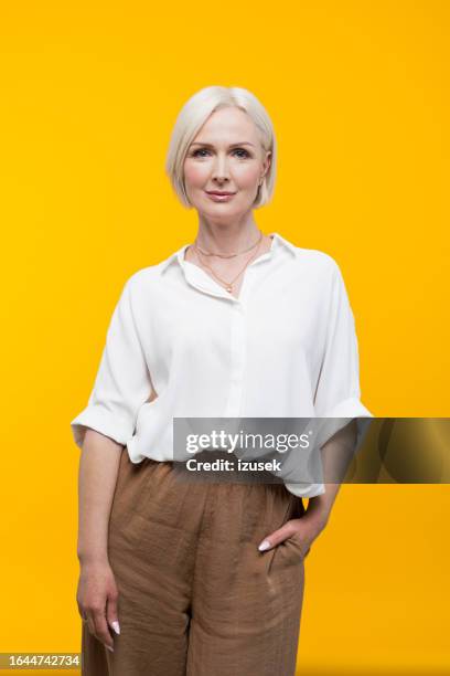 portrait of beautiful mature woman - woman with white shirt stock pictures, royalty-free photos & images
