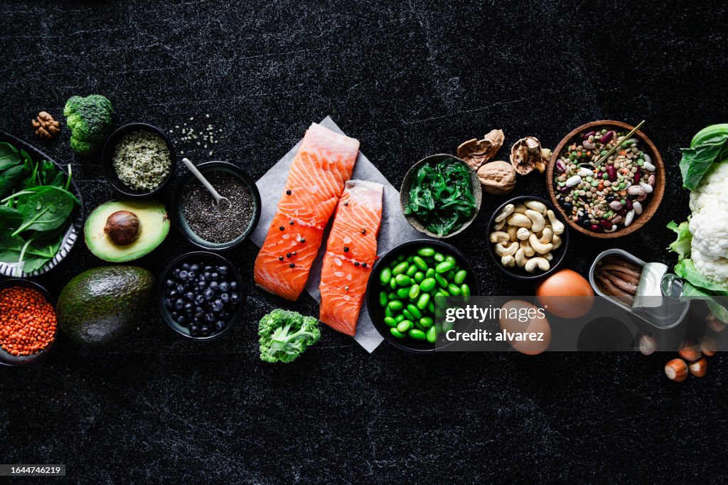 Top view of Omega 3 food items on black table