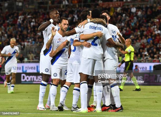 Denzel Dumfries of FC Internazionale celebrates with team-mates after scoring the goal during the Serie A TIM match between Cagliari Calcio and FC...