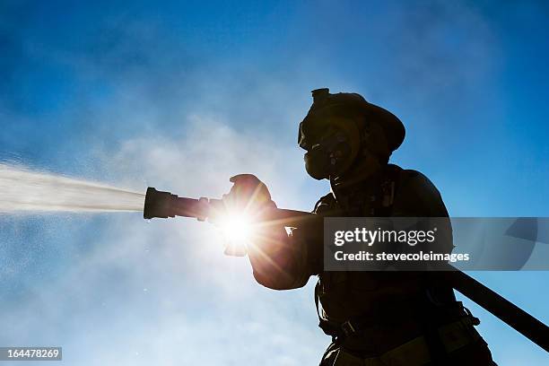 firefighter - industrial hose stockfoto's en -beelden