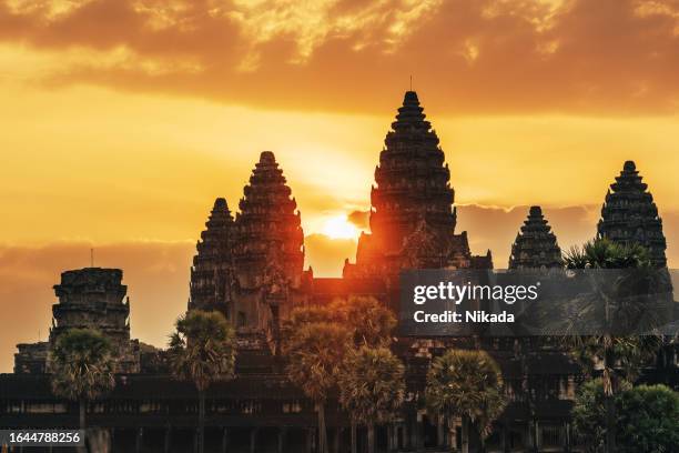 sunrise at the angkor wat temple in cambodia - angkor wat stock pictures, royalty-free photos & images