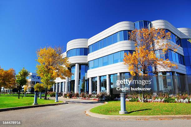 colorido edifício empresarial em queda - medical clinic building imagens e fotografias de stock