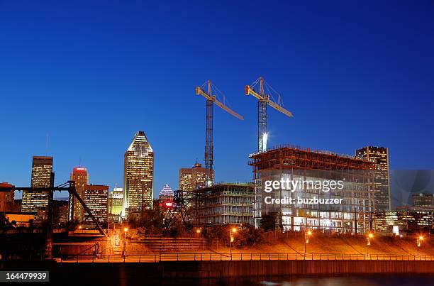 illuminated construction building at night - montreal quebec stock pictures, royalty-free photos & images