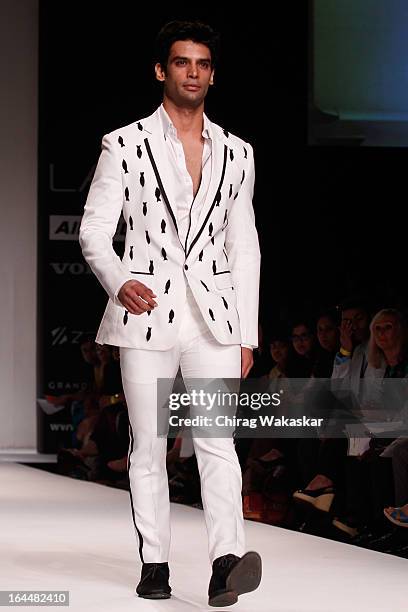 Model showcases designs by Nikhil Thampi on the runway during day two of the Lakme Fashion Week Summer/Resort 2013 on March 23, 2013 at Grand Hyatt...