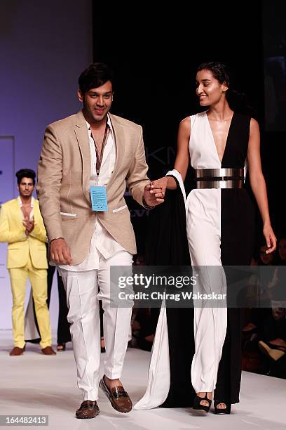 Designer Nikhil Thampi on the runway during day two of the Lakme Fashion Week Summer/Resort 2013 on March 23, 2013 at Grand Hyatt in Mumbai, India.