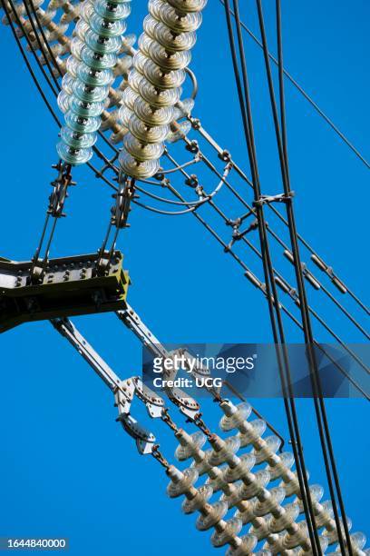 Close-up of high voltage insulators on an electricity pylon by Sandford industrial estate.