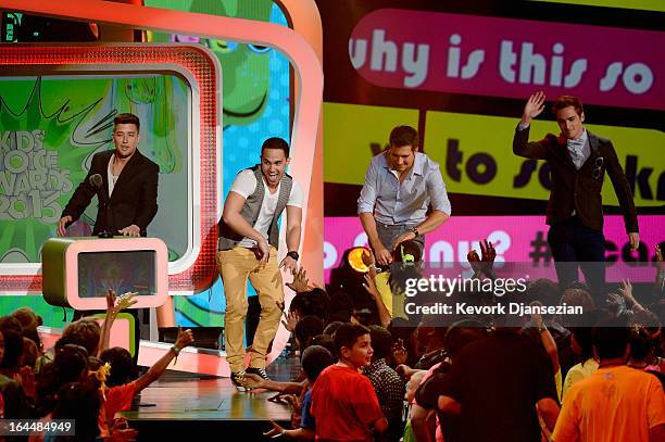 Singers Logan Henderson, Carlos Pena Jr., James Maslow and Kendall Schmidt of Big Time Rush walk onstage during Nickelodeon's 26th Annual Kids'...