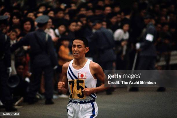 Kenji Kimihara of Japan competes in the Men's Marathon during Tokyo Olympic on October 21, 1964 in Tokyo, Japan.
