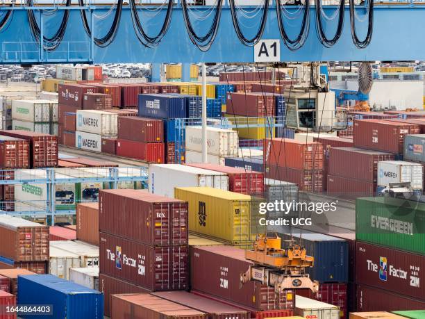 Giant gantry cranes and tracks in a container port, viewed from a moored cruise ship in Ashdod, Israel.