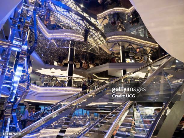 Glitzy atrium and shopping arcade of a ocean liner cruising the North Sea.