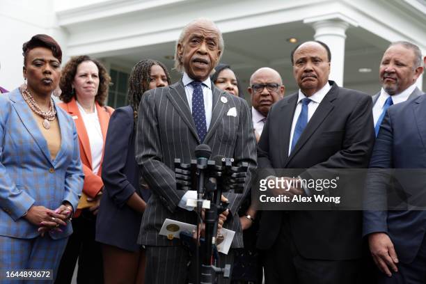 The Rev. Al Sharpton speaks to members of the press as Martin Luther King III, his wife Arndrea Waters King and daughter Yolanda King and other...