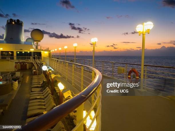 Deserted jogging track of a cruise ship at sunrise as it sails the Mediterranean.