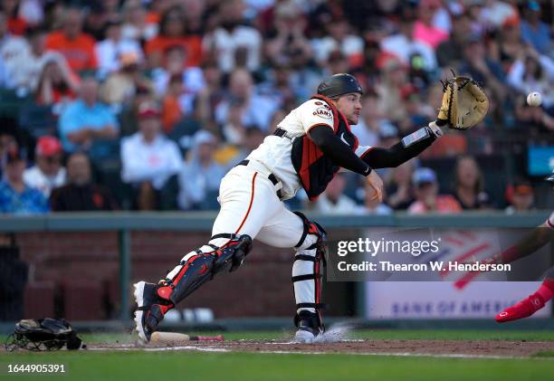 Patrick Bailey of the San Francisco Giants takes the throw at home plates against the Atlanta Braves in the top of the fifth inning at Oracle Park on...