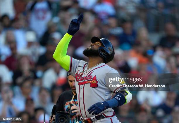 Marcell Ozuna of the Atlanta Braves celebrates after hitting a two-run home run against the San Francisco Giants in the top of the six inning at...