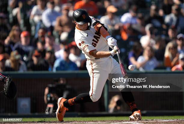 Casey Schmitt of the San Francisco Giants hits a solo home run against the Atlanta Braves in the bottom of the second inning at Oracle Park on August...