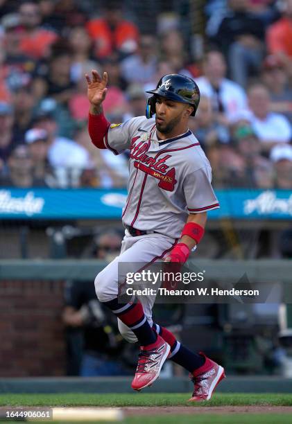 Eddie Rosario of the Atlanta Braves scores against the San Francisco Giants in the top of the fifth inning at Oracle Park on August 27, 2023 in San...