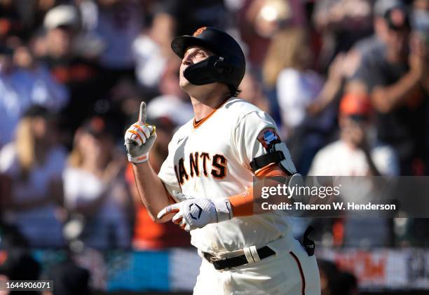 Casey Schmitt of the San Francisco Giants celebrates after hitting a solo home run against the Atlanta Braves in the bottom of the second inning at...