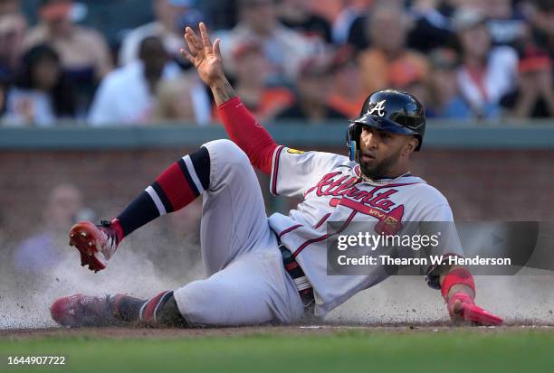 Eddie Rosario of the Atlanta Braves scores against the San Francisco Giants in the top of the fifth inning at Oracle Park on August 27, 2023 in San...
