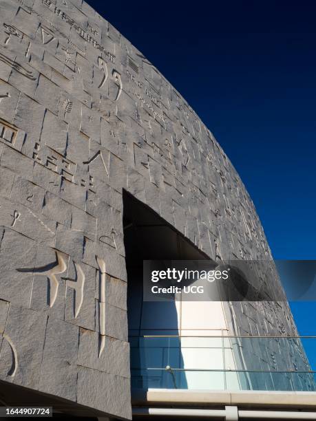 The symbol wall of the Bibliotheca Alexandrina Library by the Mediterranean in Alexandria, Egypt.
