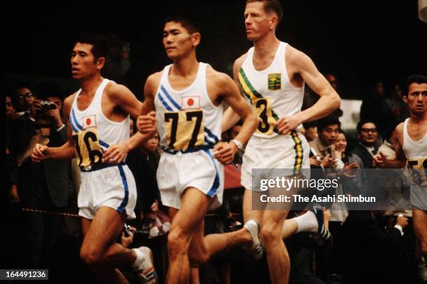Toru Terasawa and Kokichi Tsuburaya of Japan compete in the Men's Marathon during Tokyo Olympic on October 21, 1964 in Tokyo, Japan.