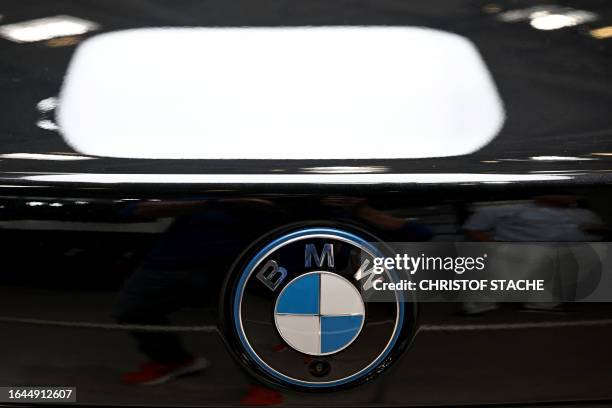 The logo of German car maker BMW is seen on an i7 Protection car at the International Motor Show in Munich, southern Germany, on September 4, 2023....