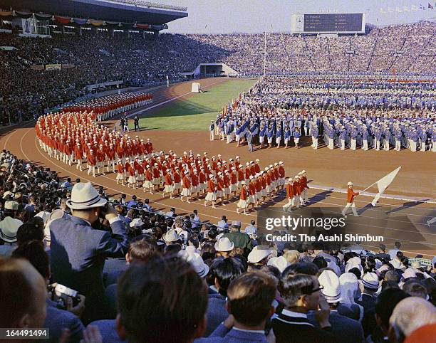 Delegation Japan march during the Tokyo Olympic Opening Ceremony at the National Stadium on October 10, 1964 in Tokyo, Japan.