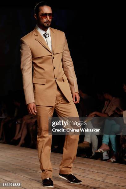 Model showcases designs by Kunal Rawal on the runway during day two of the Lakme Fashion Week Summer/Resort 2013 on March 23, 2013 at Grand Hyatt in...