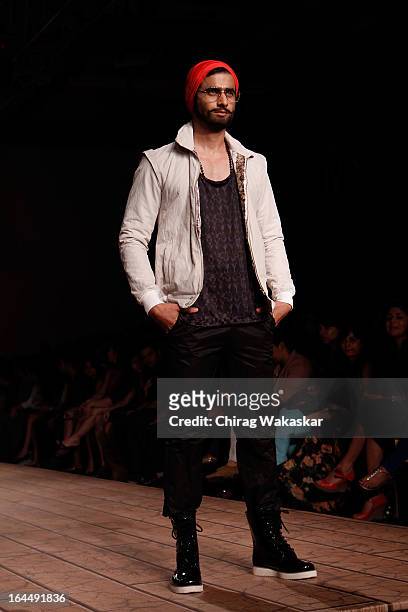 Model showcases designs by Kunal Rawal on the runway during day two of the Lakme Fashion Week Summer/Resort 2013 on March 23, 2013 at Grand Hyatt in...