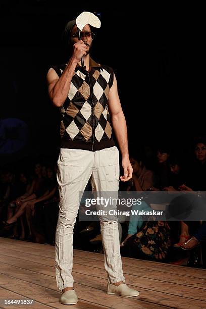 Model showcases designs by Kunal Rawal on the runway during day two of the Lakme Fashion Week Summer/Resort 2013 on March 23, 2013 at Grand Hyatt in...