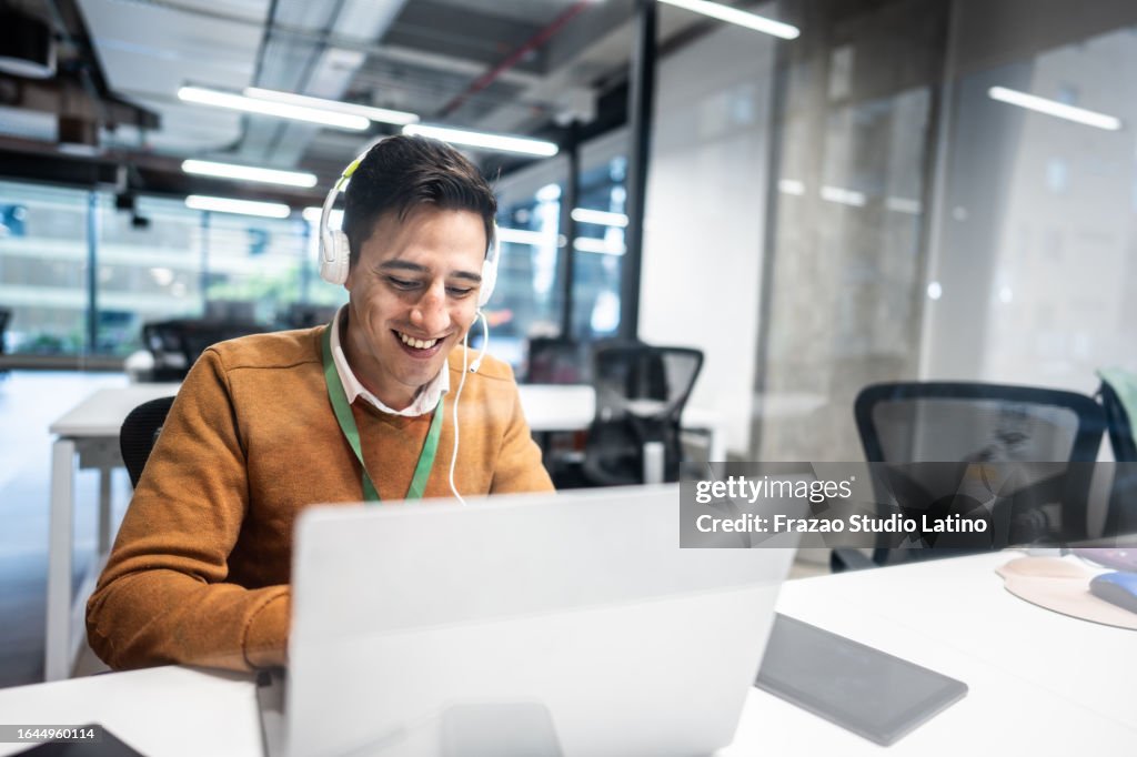 Mid adult man working on a call center in the office