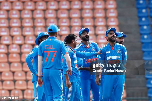 Indian players wait for a DRS review during the Asia Cup Group A match between India and Nepal at Pallekele International Cricket Stadium on...