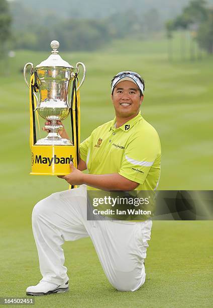 Kiradech Aphibarnrat of Thailand celebrates with the trophy after winning the 3rd and final round of the Maybank Malaysian Open at Kuala Lumpur Golf...