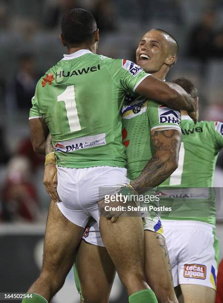 Sandor Earl congratulates Reece Robinson of the Raiders during the round three NRL match between the Canberra Raiders and the St George Illawarra...