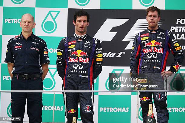 Race winner Sebastian Vettel of Germany and Infiniti Red Bull Racing, second placed Mark Webber of Australia and Infiniti Red Bull Racing and...